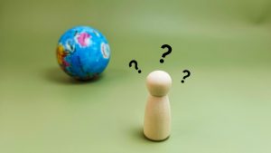 Globe and man thinking